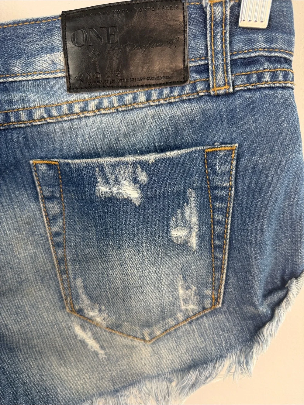 One Teaspoon NO 2’s Low Rise Jean Shorts 8” Rise Raw Curved Hem Sz 25 Distressed